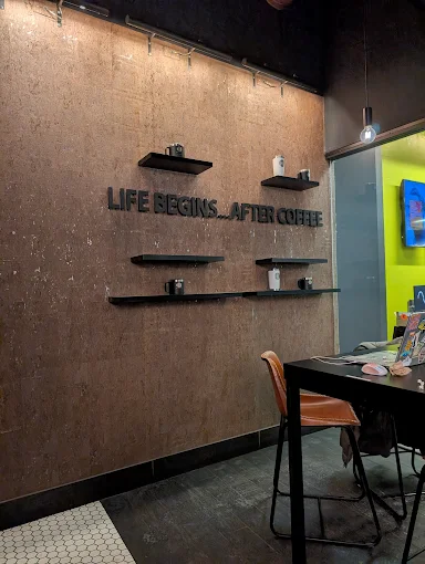 Birmingham Roast brand wall reading Life Begins After Coffee
