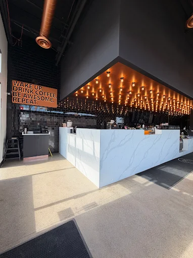 Plymouth Roast counter with string light canopy